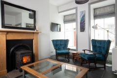 Jackie's House living room with a warming fire