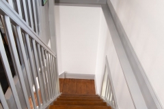 Jackie's House looking down the staircase to the living room
